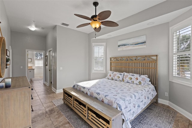 bedroom with multiple windows and ceiling fan