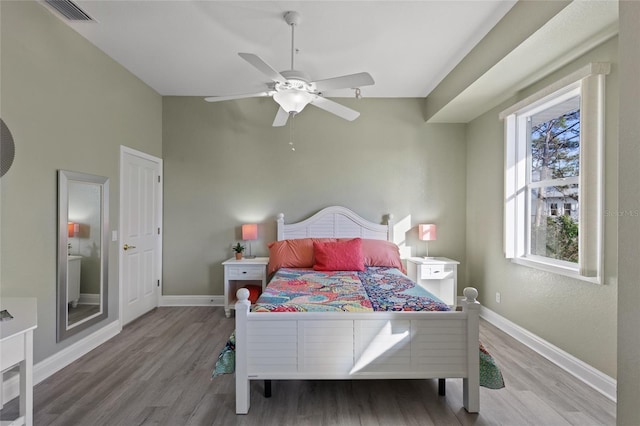 bedroom with hardwood / wood-style flooring and ceiling fan