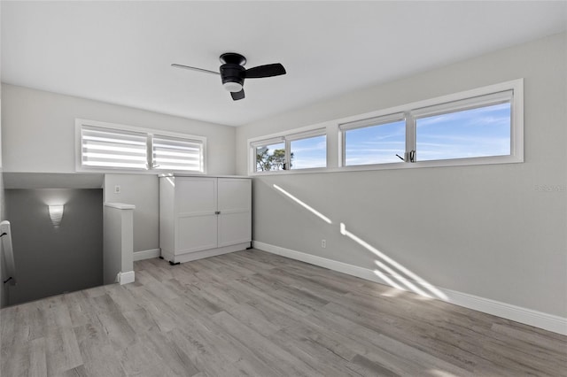 interior space featuring ceiling fan and light wood-type flooring