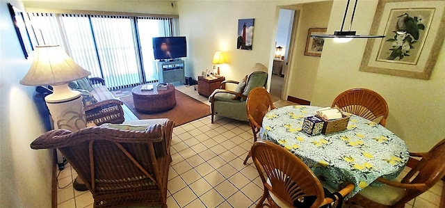 living room featuring tile patterned flooring and ceiling fan