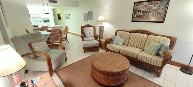 living area featuring light tile patterned flooring