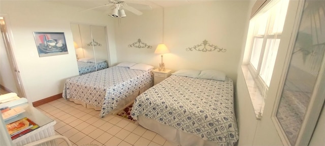 tiled bedroom with ceiling fan