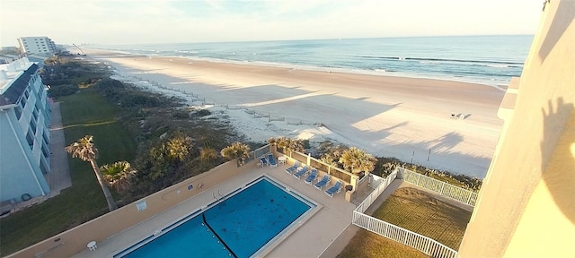 birds eye view of property with a view of the beach and a water view