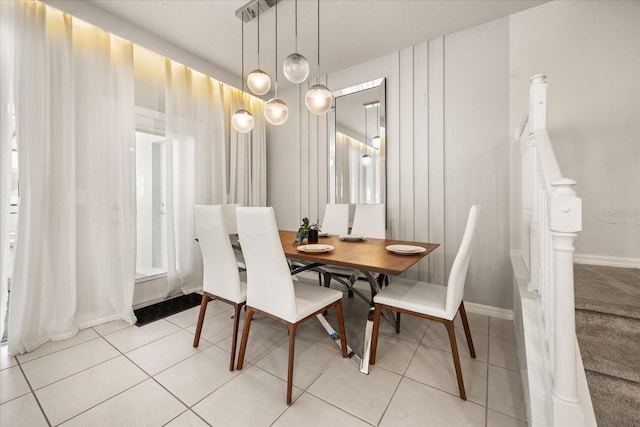 dining area with light tile patterned floors