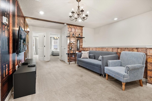 carpeted living room with a notable chandelier