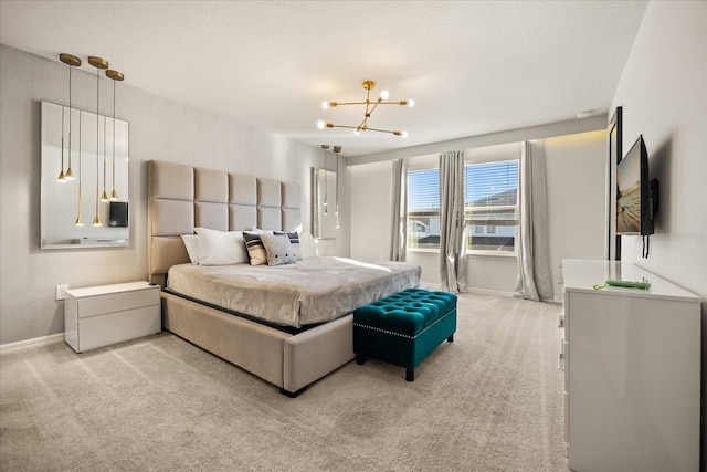 carpeted bedroom with a notable chandelier and a textured ceiling