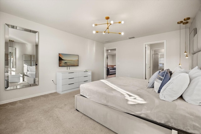 bedroom with light carpet and a chandelier