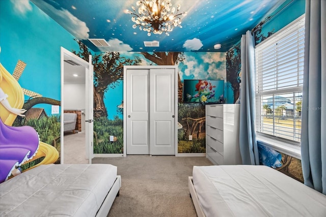 carpeted bedroom with an inviting chandelier