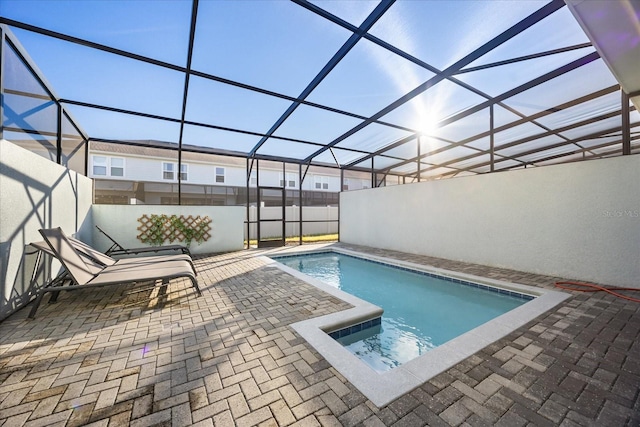 view of pool featuring a patio and a lanai