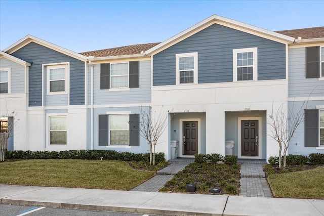 view of front of home with a front lawn