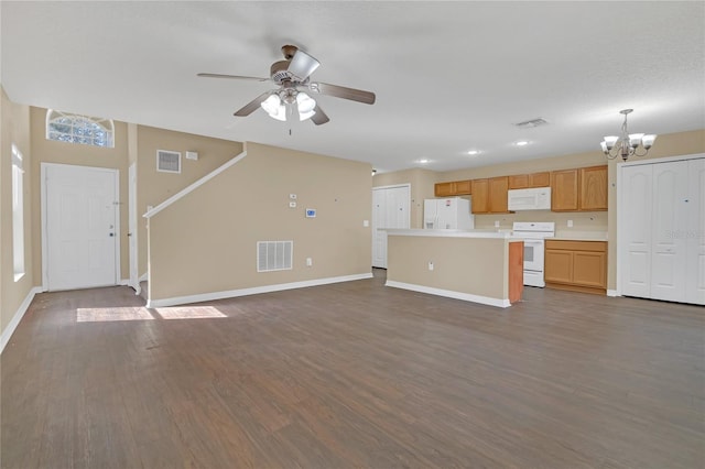 unfurnished living room with dark wood-type flooring and ceiling fan with notable chandelier