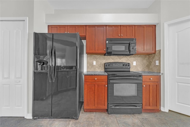 kitchen with tasteful backsplash and black appliances