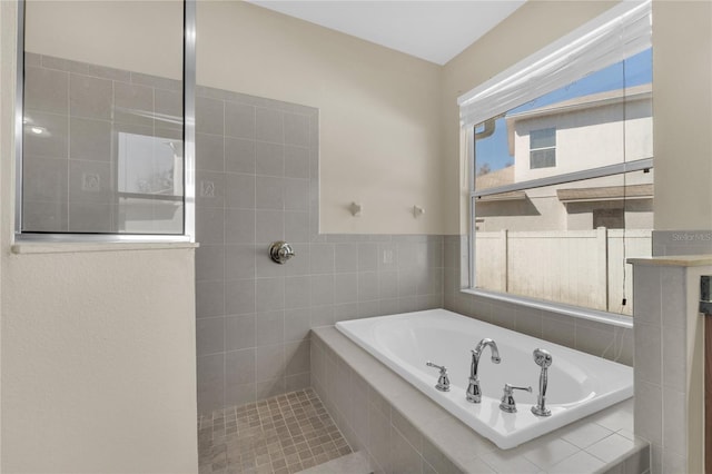 bathroom with tiled bath