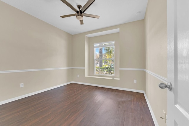 spare room with ceiling fan and dark hardwood / wood-style flooring