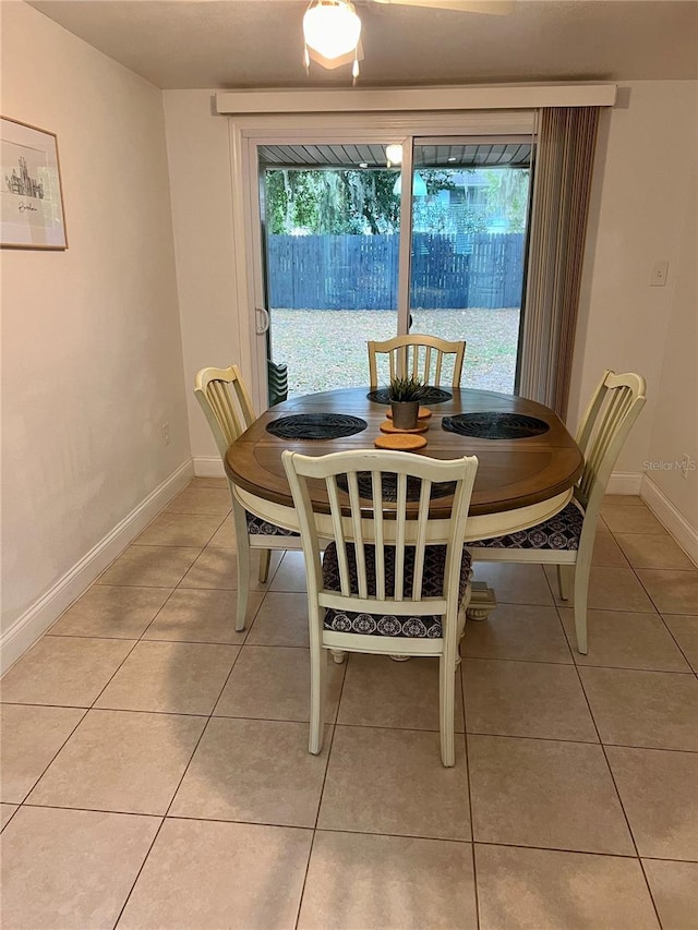 dining space featuring tile patterned flooring