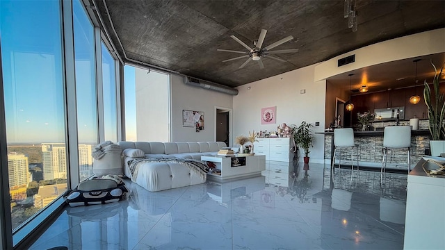 living room with ceiling fan