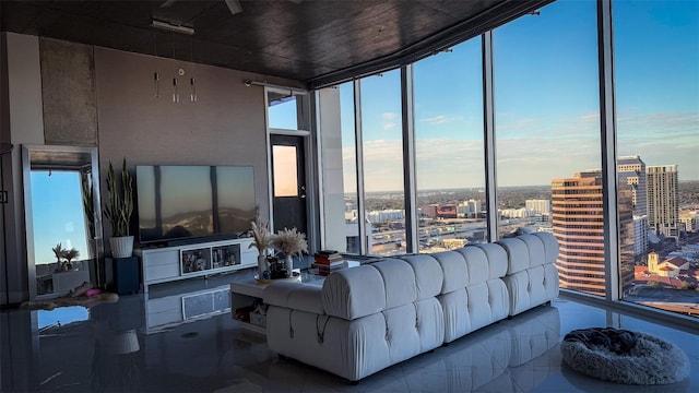 living room featuring tile patterned flooring and floor to ceiling windows