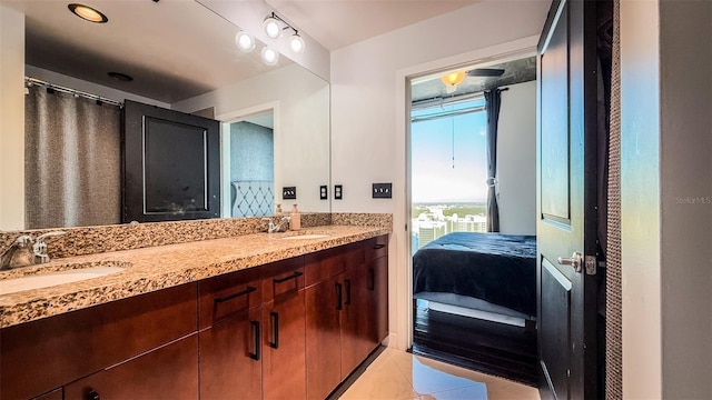 bathroom featuring tile patterned flooring and vanity