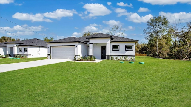 prairie-style home with a garage and a front lawn