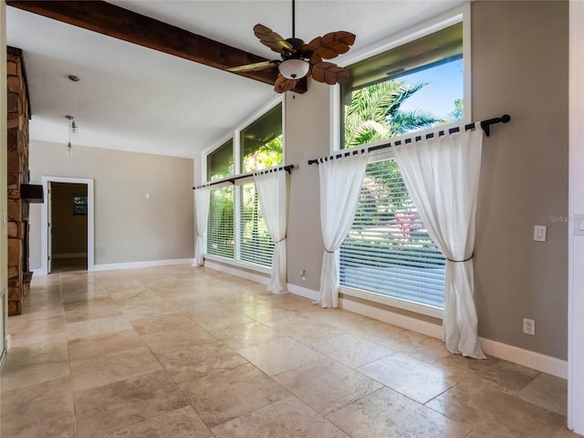 spare room with lofted ceiling with beams and ceiling fan