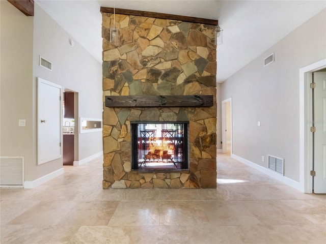 unfurnished living room featuring a fireplace and high vaulted ceiling