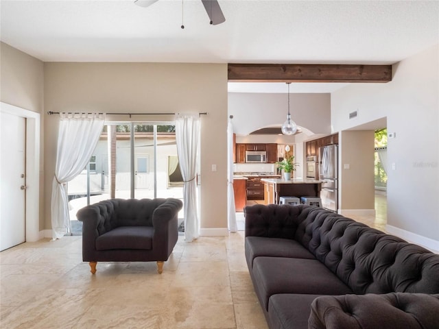 living room featuring ceiling fan and lofted ceiling with beams