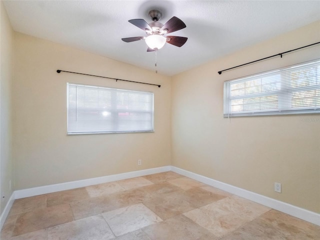 unfurnished room with ceiling fan