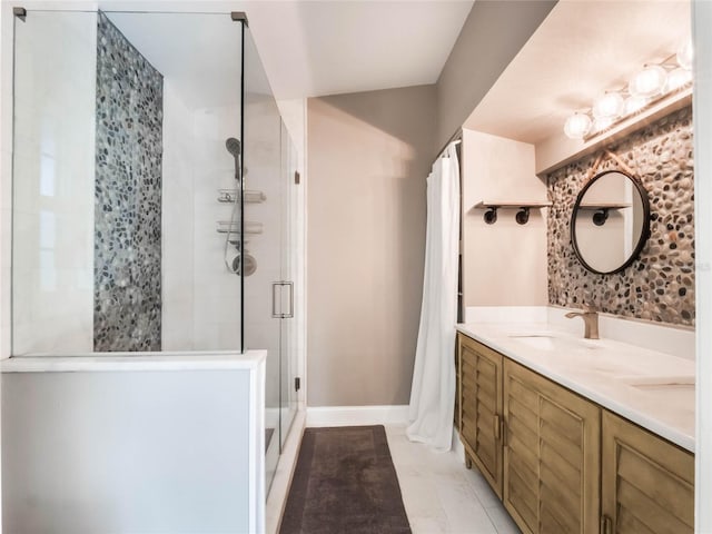 bathroom featuring vanity and a shower with shower door