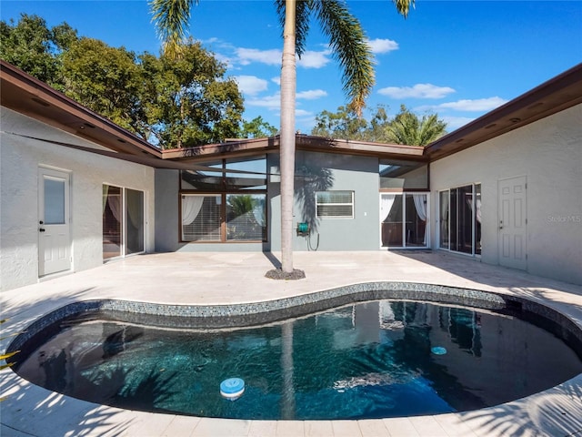 view of swimming pool featuring a patio area