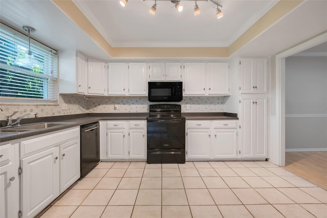 kitchen with white cabinetry, sink, light tile patterned floors, and black appliances