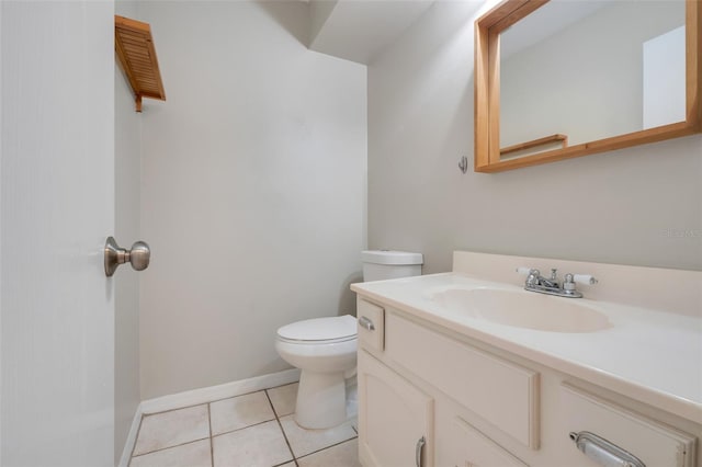 bathroom with vanity, tile patterned floors, and toilet