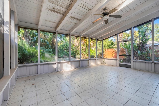 unfurnished sunroom with lofted ceiling with beams and ceiling fan