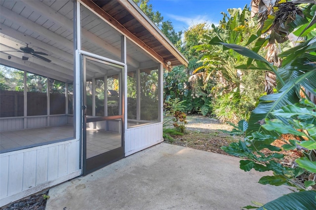 view of patio featuring ceiling fan and a sunroom