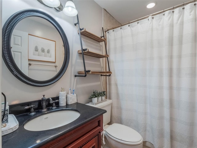 bathroom featuring vanity, a shower with curtain, and toilet