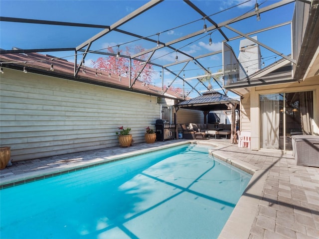 view of pool with a gazebo, area for grilling, a lanai, an outdoor hangout area, and a patio