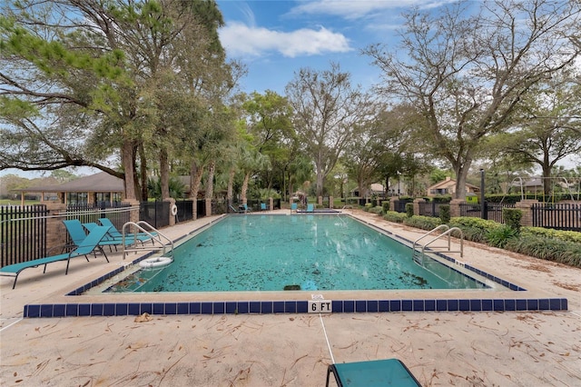 view of pool featuring a patio