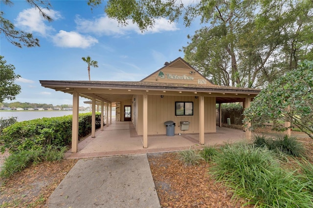 exterior space featuring a patio and a water view