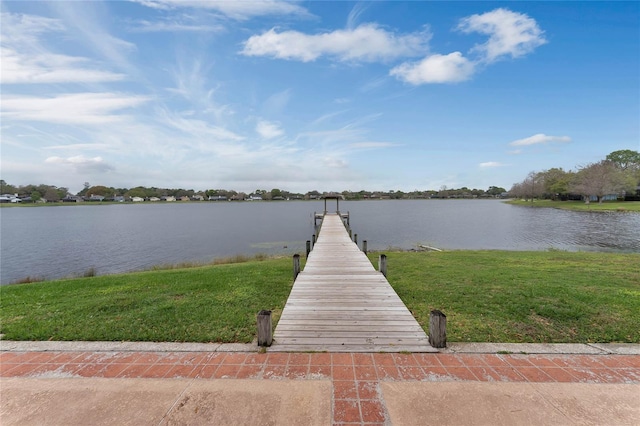 dock area featuring a yard and a water view