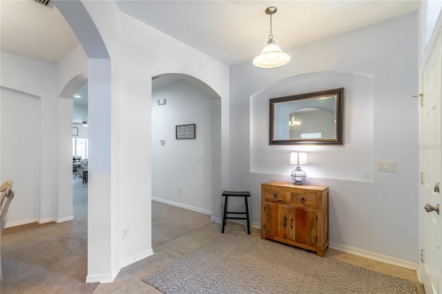 hallway featuring light tile patterned flooring