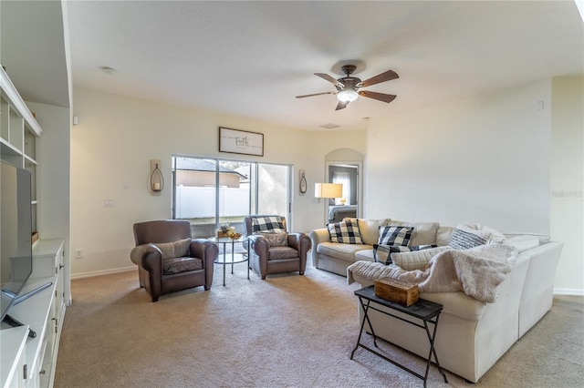 living room with light colored carpet and ceiling fan