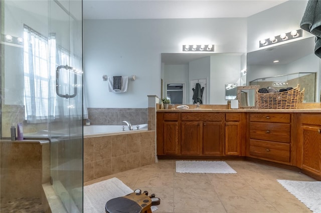 bathroom featuring vanity, tile patterned flooring, and plus walk in shower