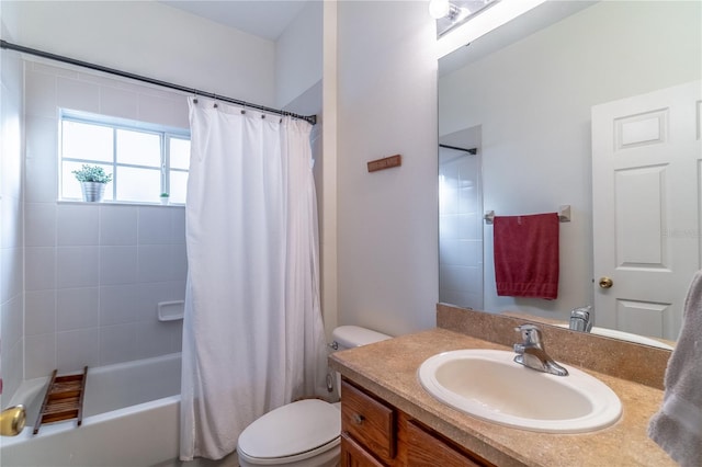 full bathroom with vanity, shower / bath combo with shower curtain, and toilet