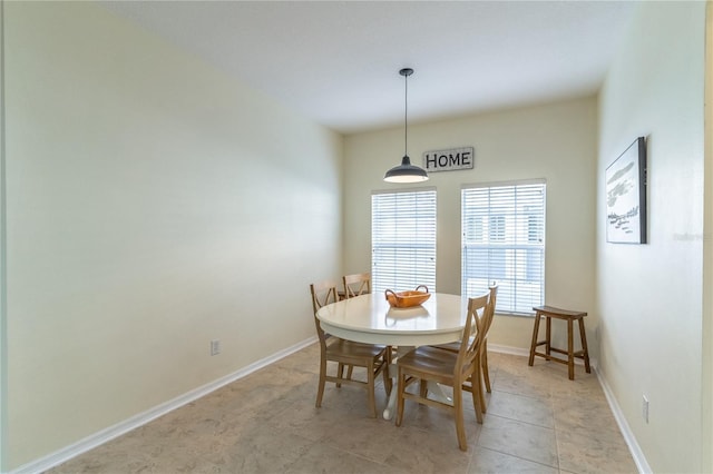 dining area with light tile patterned floors