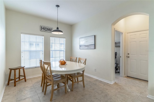 dining area with light tile patterned floors