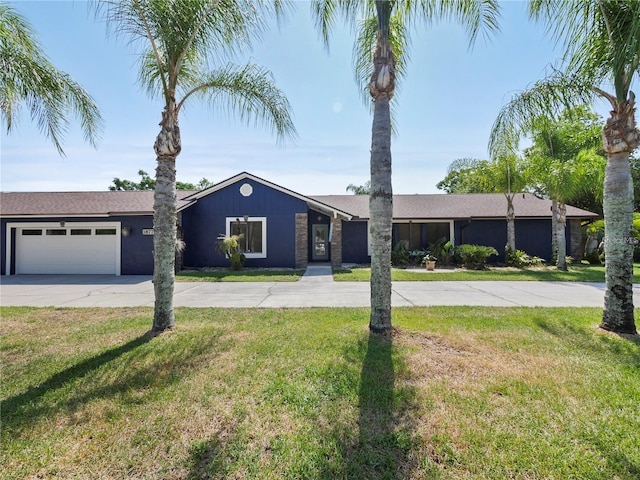 ranch-style house with a garage and a front yard