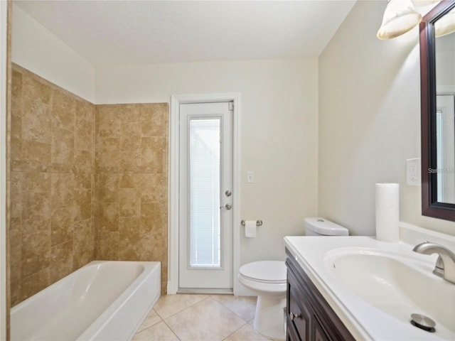 bathroom featuring vanity, toilet, and tile patterned flooring