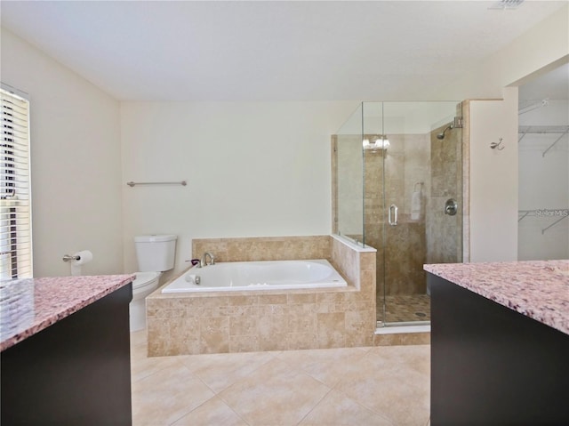 full bathroom featuring vanity, tile patterned floors, plus walk in shower, and toilet