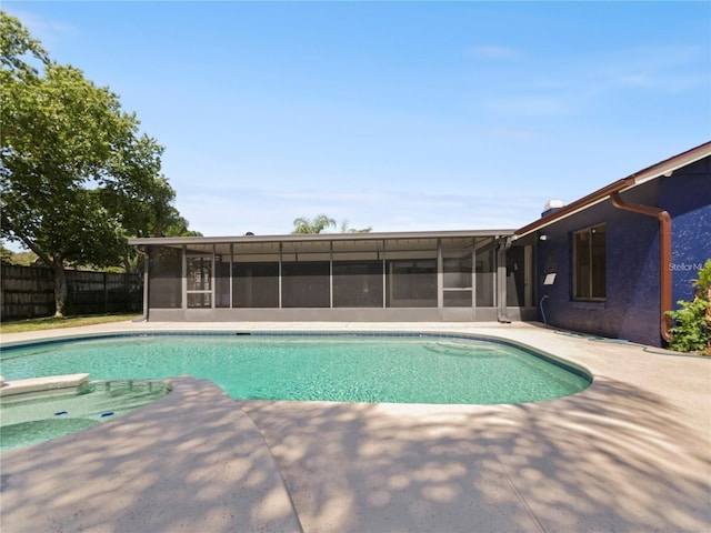 view of pool with a patio area and a sunroom