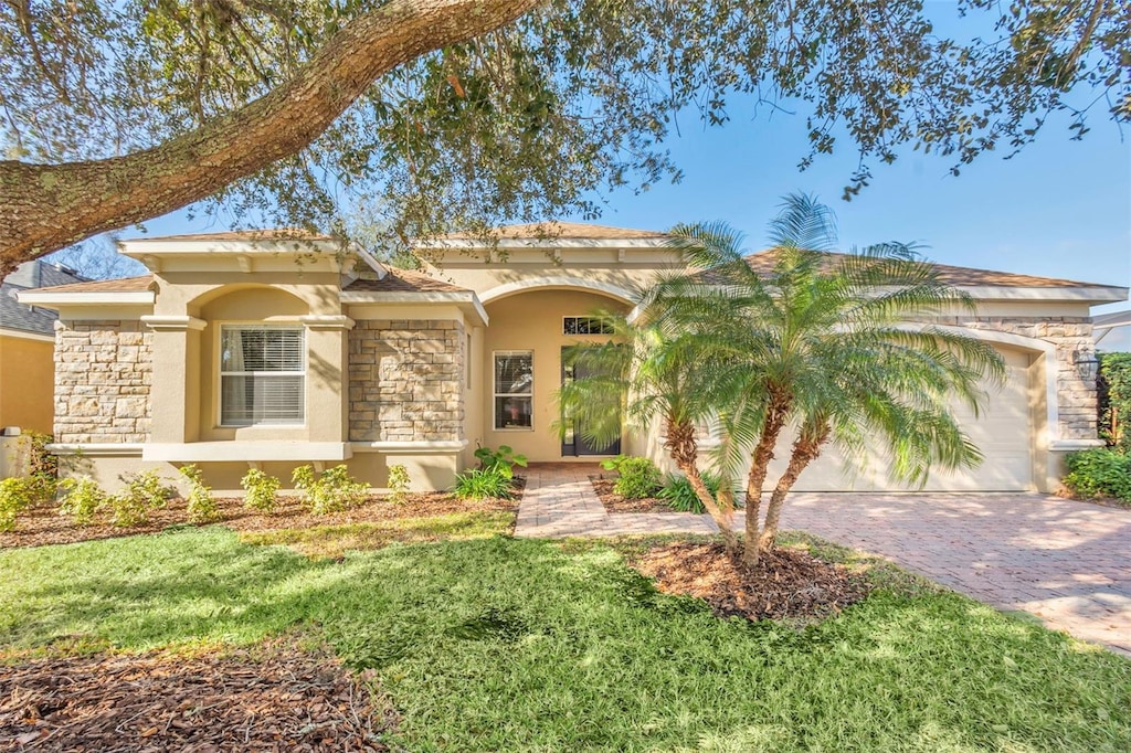 mediterranean / spanish-style house with a garage