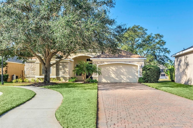 view of front of house featuring a garage and a front yard